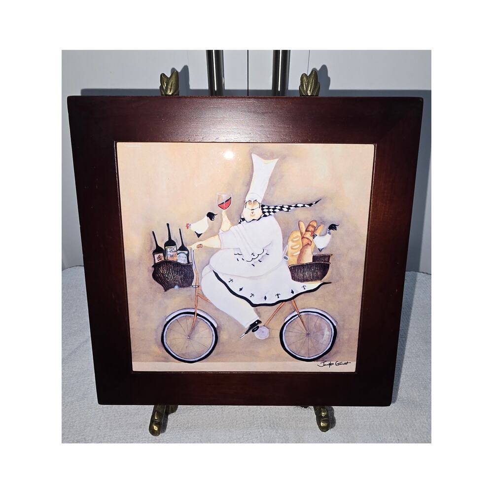 Jennifer Garant “Fat Chef on Bicycle” Framed Ceramic Tile – (2 Feet Missing)